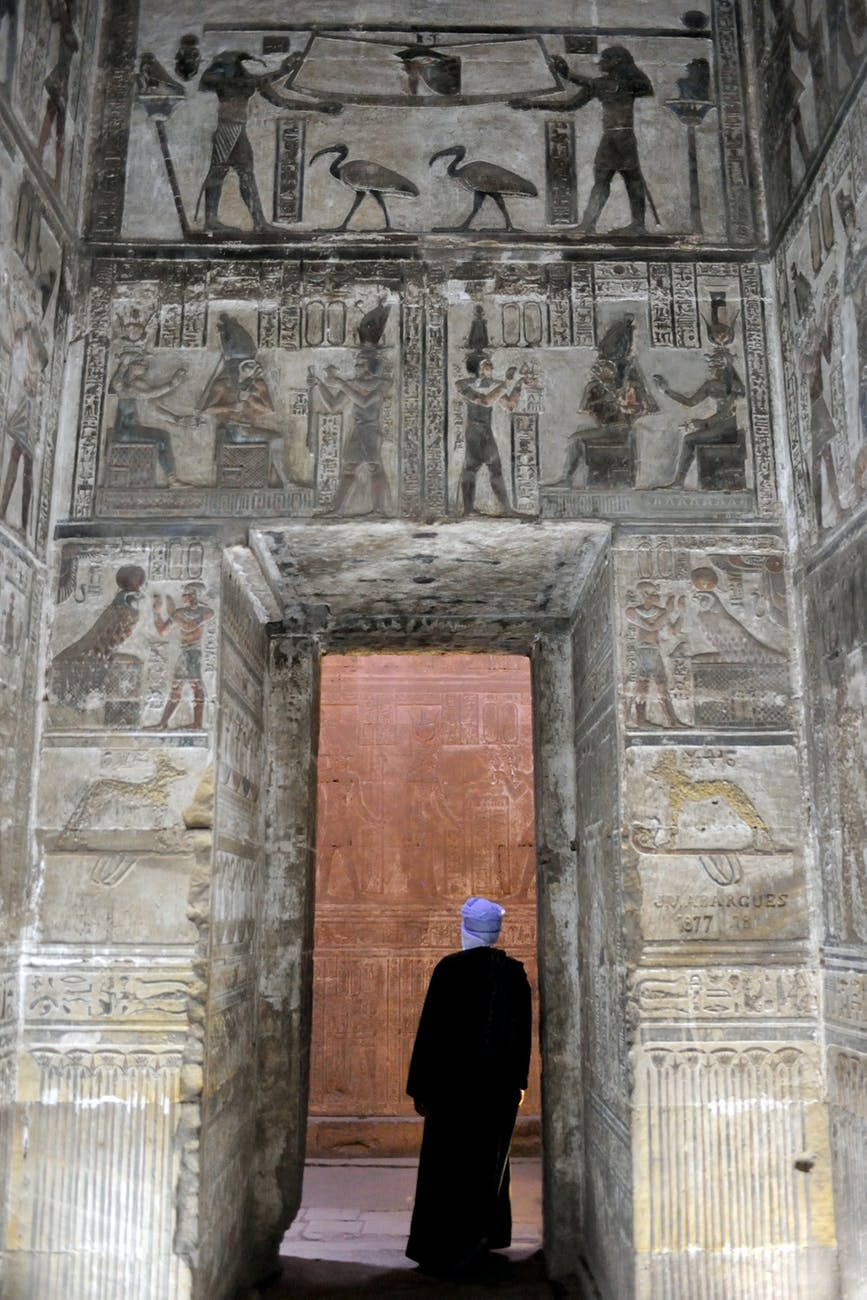 man standing inside concrete building